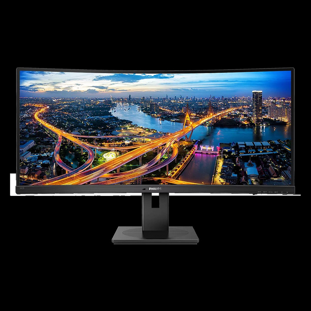 בתמונה נראה מסך Philips UltraWide בעיצוב קעור ורחב במיוחד, המיועד לסביבת עבודה מרובת משימות ולחוויית צפייה פנורמית. המסך כולל מסגרת דקה בצבע שחור ומעמד מרכזי אלגנטי בעל בסיס מלבני יציב. על גבי התצוגה מוצגת תמונת נוף עירונית מרהיבה בשעת בין ערביים, הכוללת 